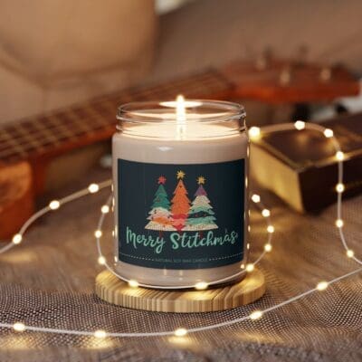Merry Stitchmas candle surrounded by fairy lights