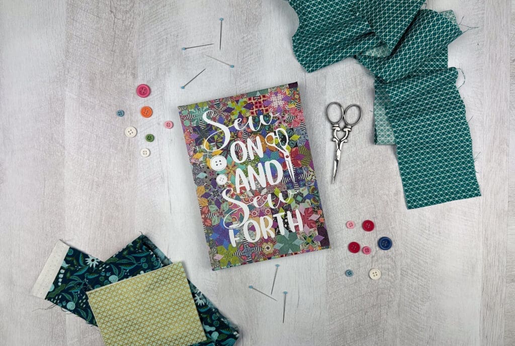 Sew on and Sew Forth DIY Custom Project Planner - colorful flat lay surrounded by buttons and sewing notions