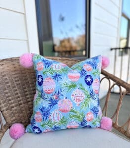 whimsical ornaments outdoor porch pillow wiht pink pom poms