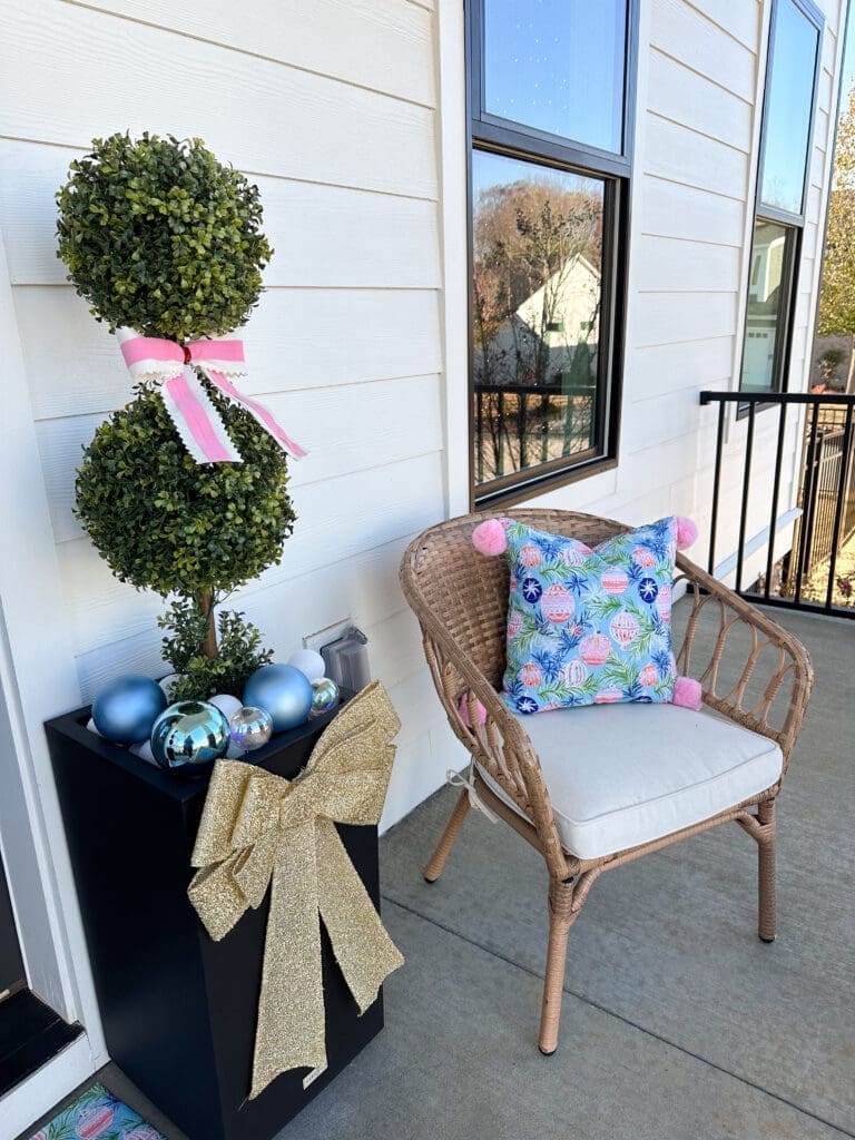Porch decorated for Christmas, pinks and blues