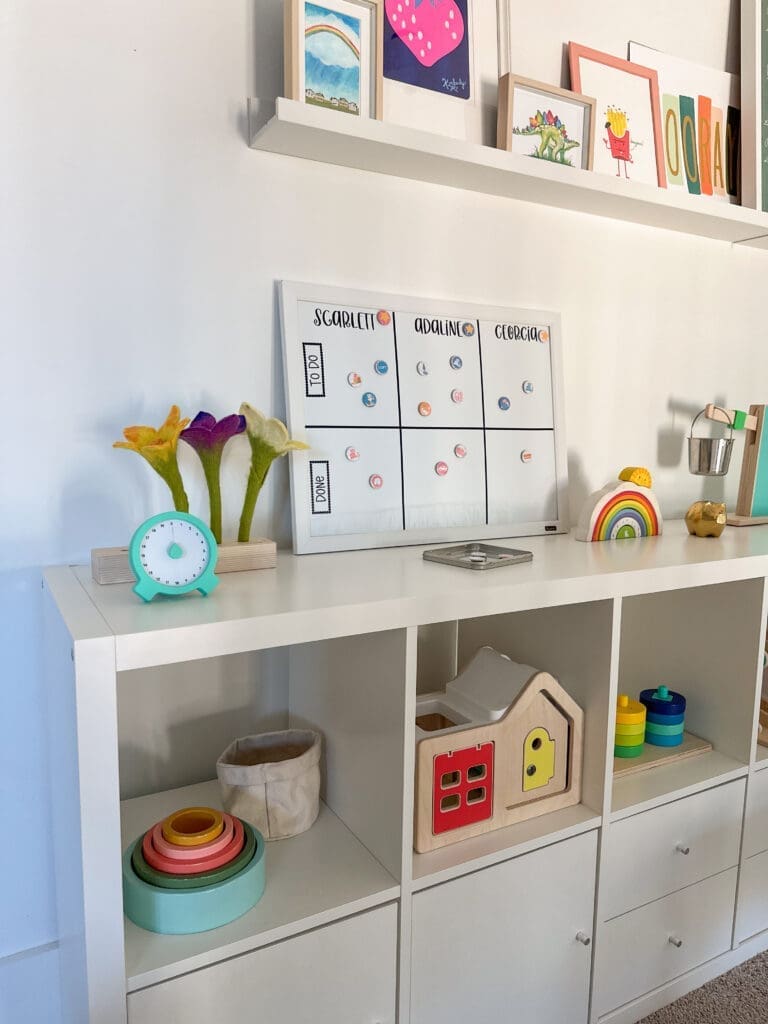 Chore chart displayed in bright and colorful kids play room 