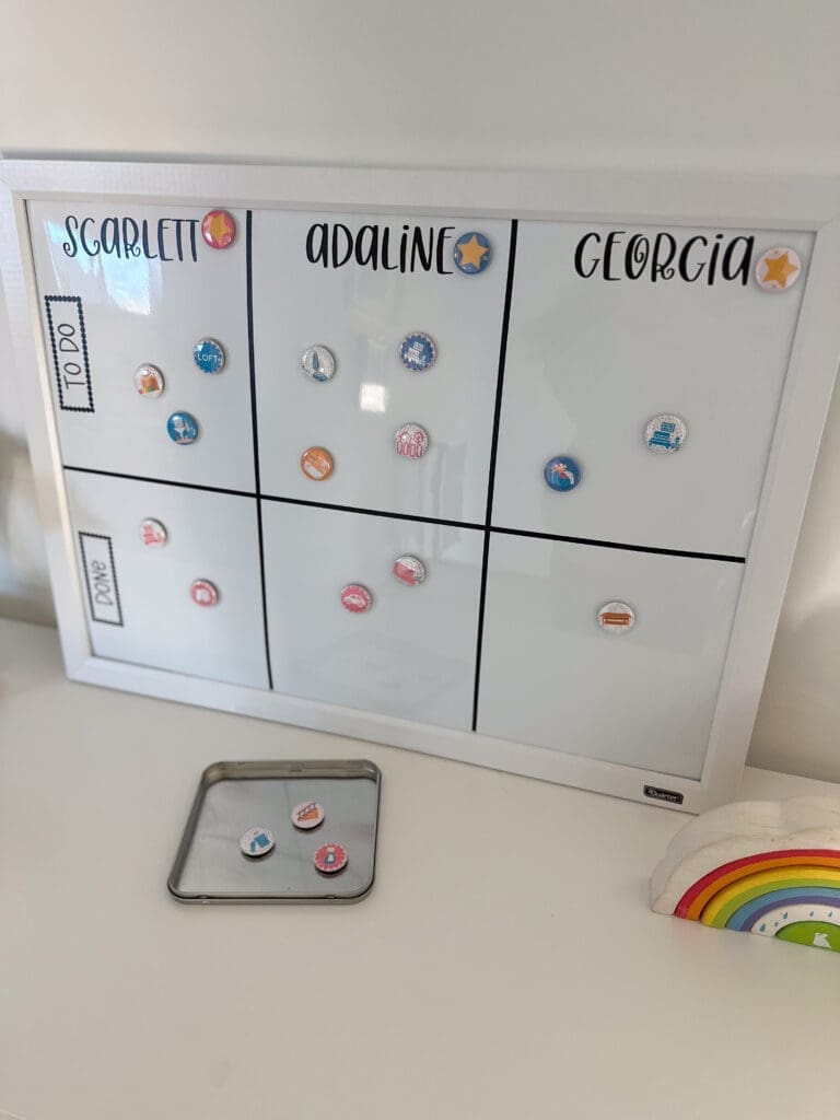 Completed magnetic chore chart, complete with colorful chore-themed magnets