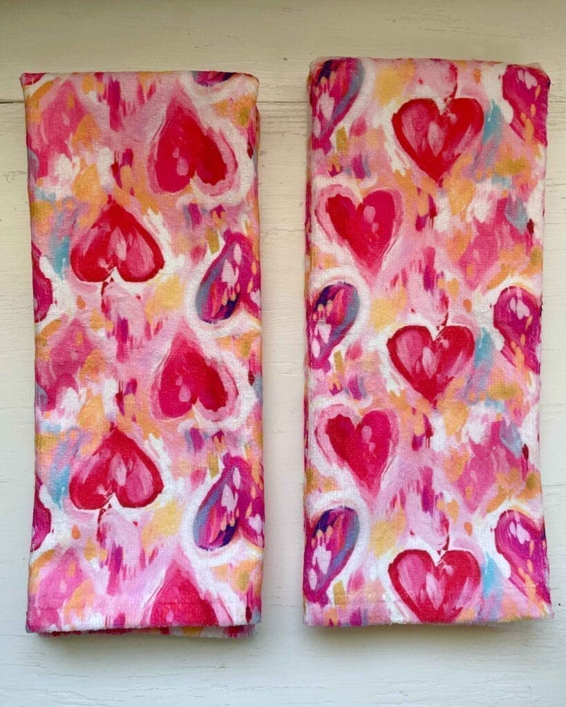 Two painted hearts valentine's day hand towels by Zappy Dots, pinks and reds