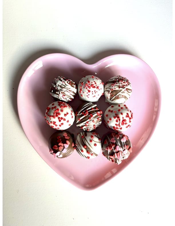 Valentine's Day cake pops on heart-shaped plate