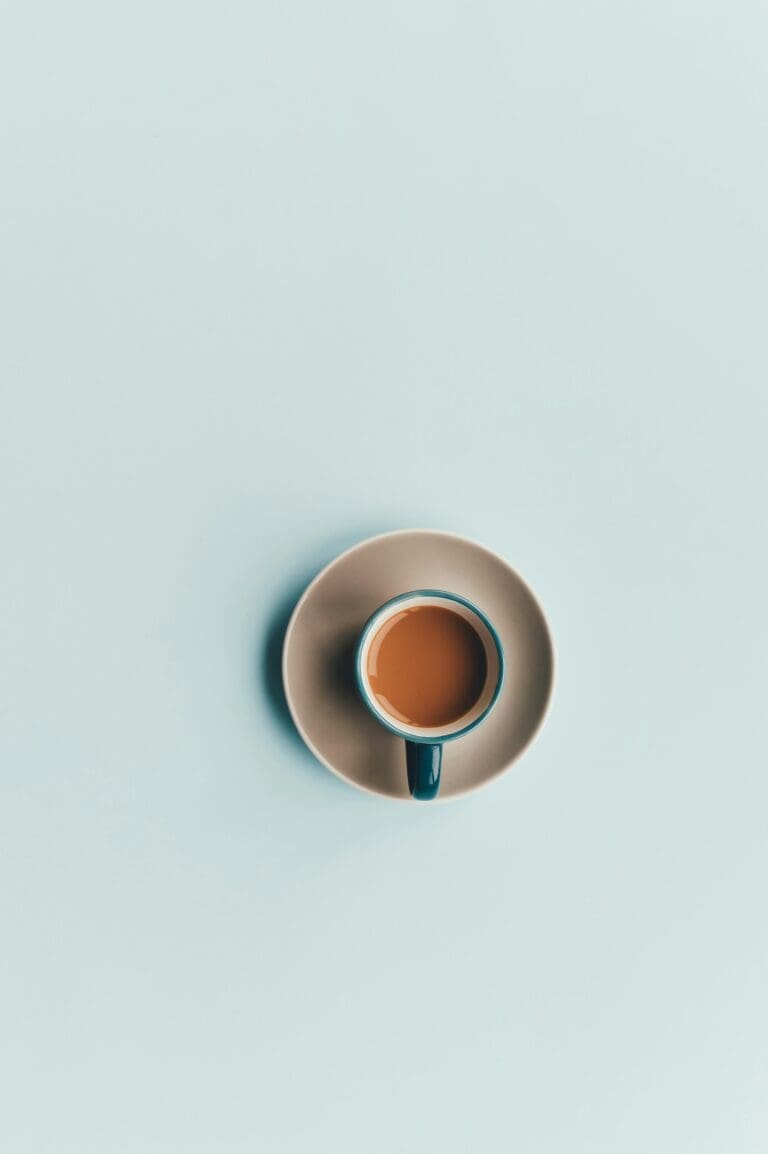 Coffee cup on teal background: Creative Girls Guide to Morning Routines